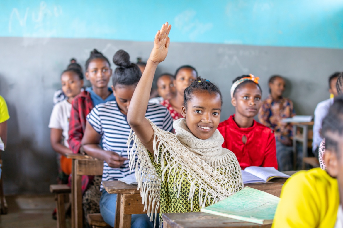 A student lifts their hand in class. Yirba Yanase Primary and Secondary School is located in Hawassa, Ethiopia. Credit: GPE/Translieu
